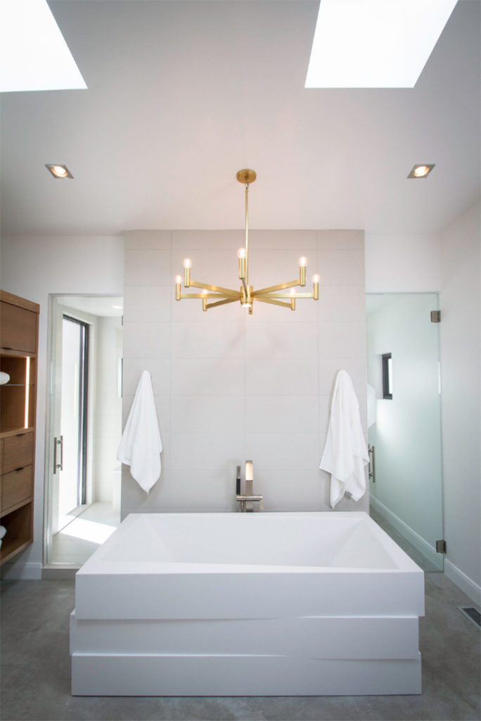 bathtub with glass shower door