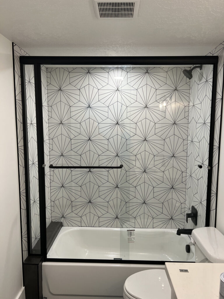 semi framed glass tub inline