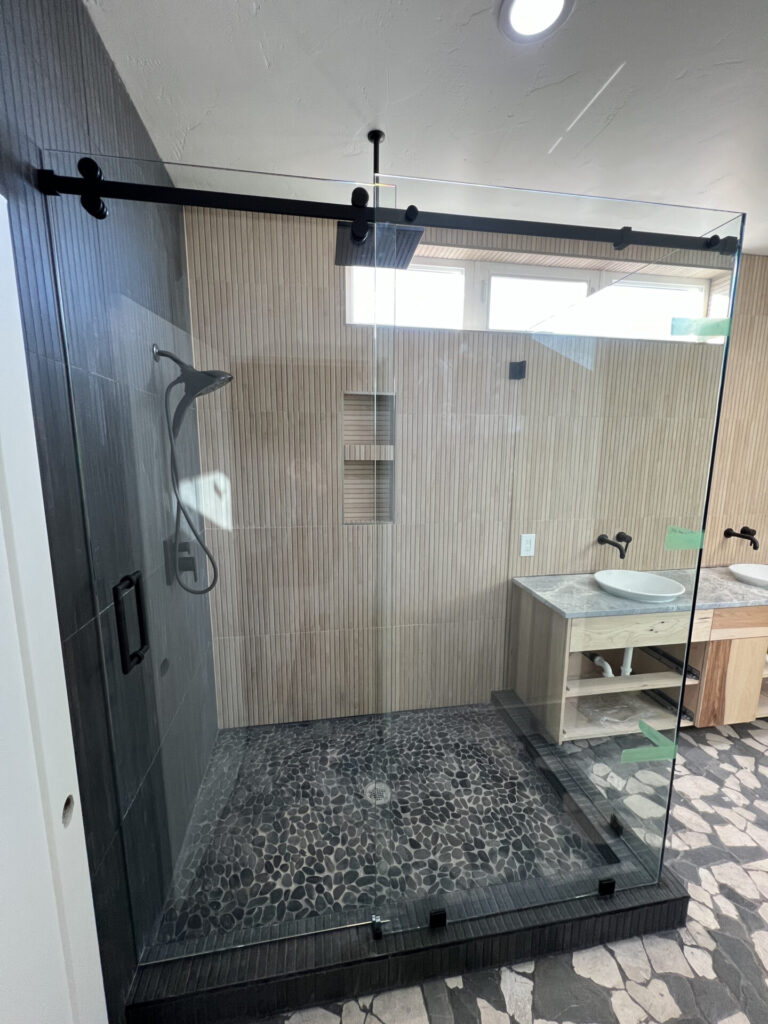 sliding barndoor glass shower enclosure